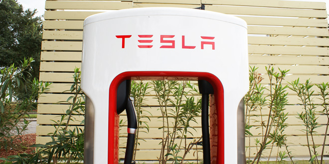 In one year, Tesla added over 850 public charging sites in the US