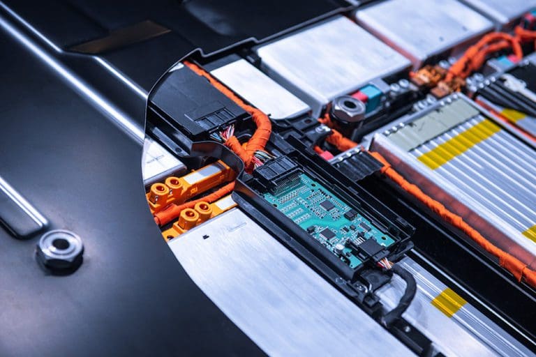 EV car battery pack. Electric car lithium battery pack. Blue toned. Car maintenance.