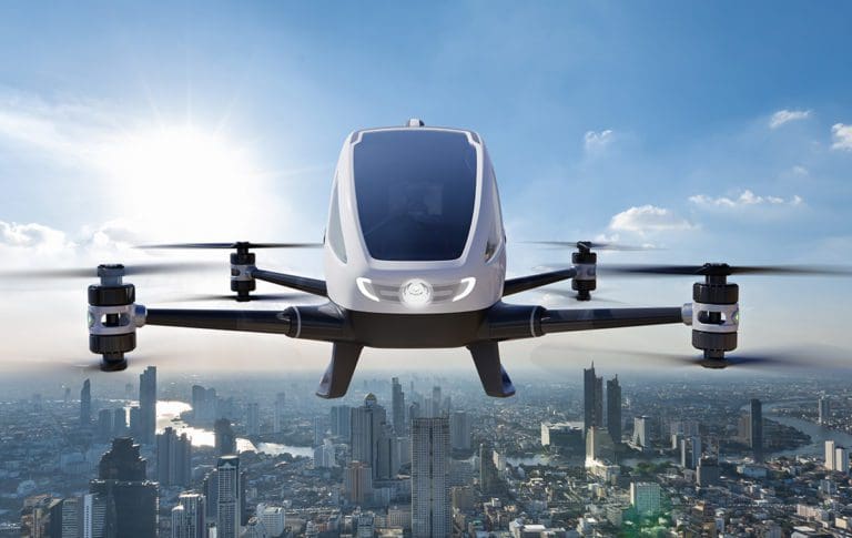 Autonomous driverless aerial vehicle flying on city background,