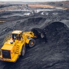 Coal mining at an open pit from above.