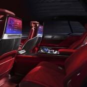 View from the driver’s side rear door of the CELESTIQ showcasing the rear seats and displays on the back of the front seats and the middle console display.
